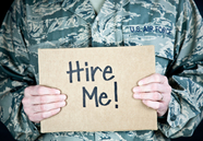 Image of military veteran with Hire Me sign