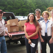 Image of pantry volunteers unloading food supplies from a truck